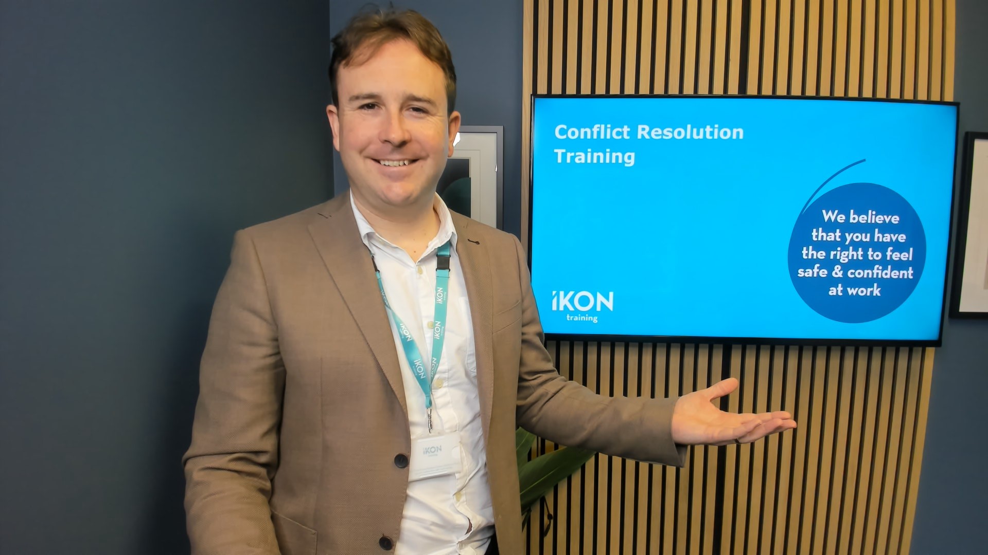 Richard Williams delivering a training session to colleagues in a professional training room setting
